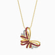 Butterfly-shaped pendant with red gemstones and rose gold chain with yellow gold