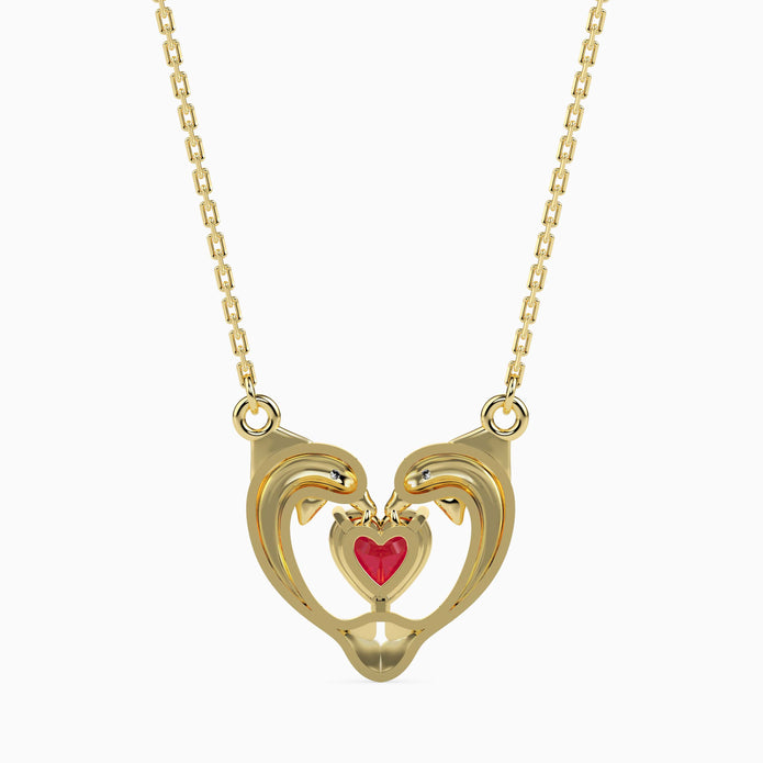 dolphin embrace red heart diamond necklace in yellow gold