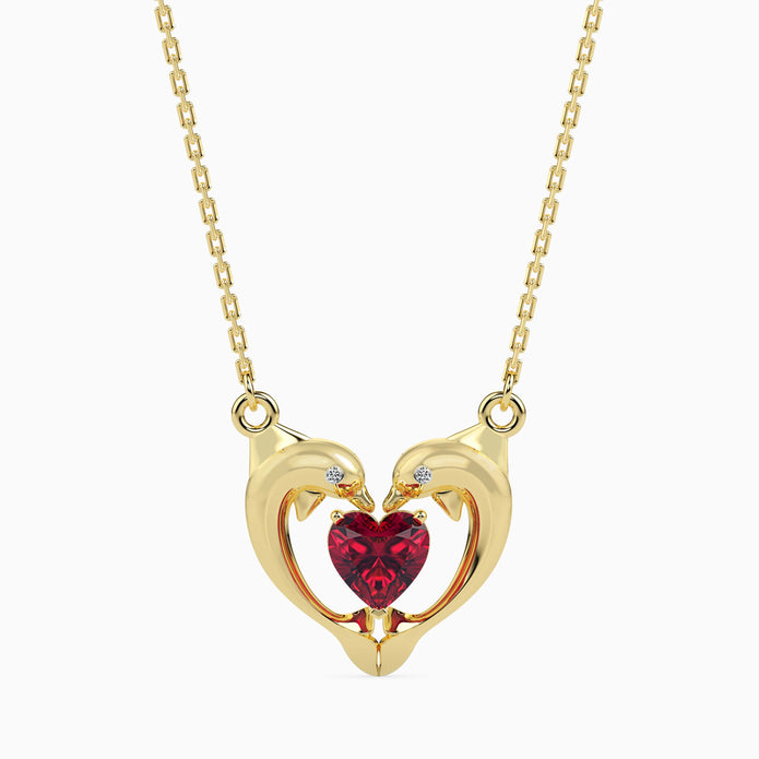 dolphin embrace red heart diamond necklace in yellow gold